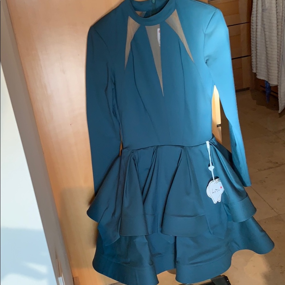 Padded shoulders / flare out forest green dress